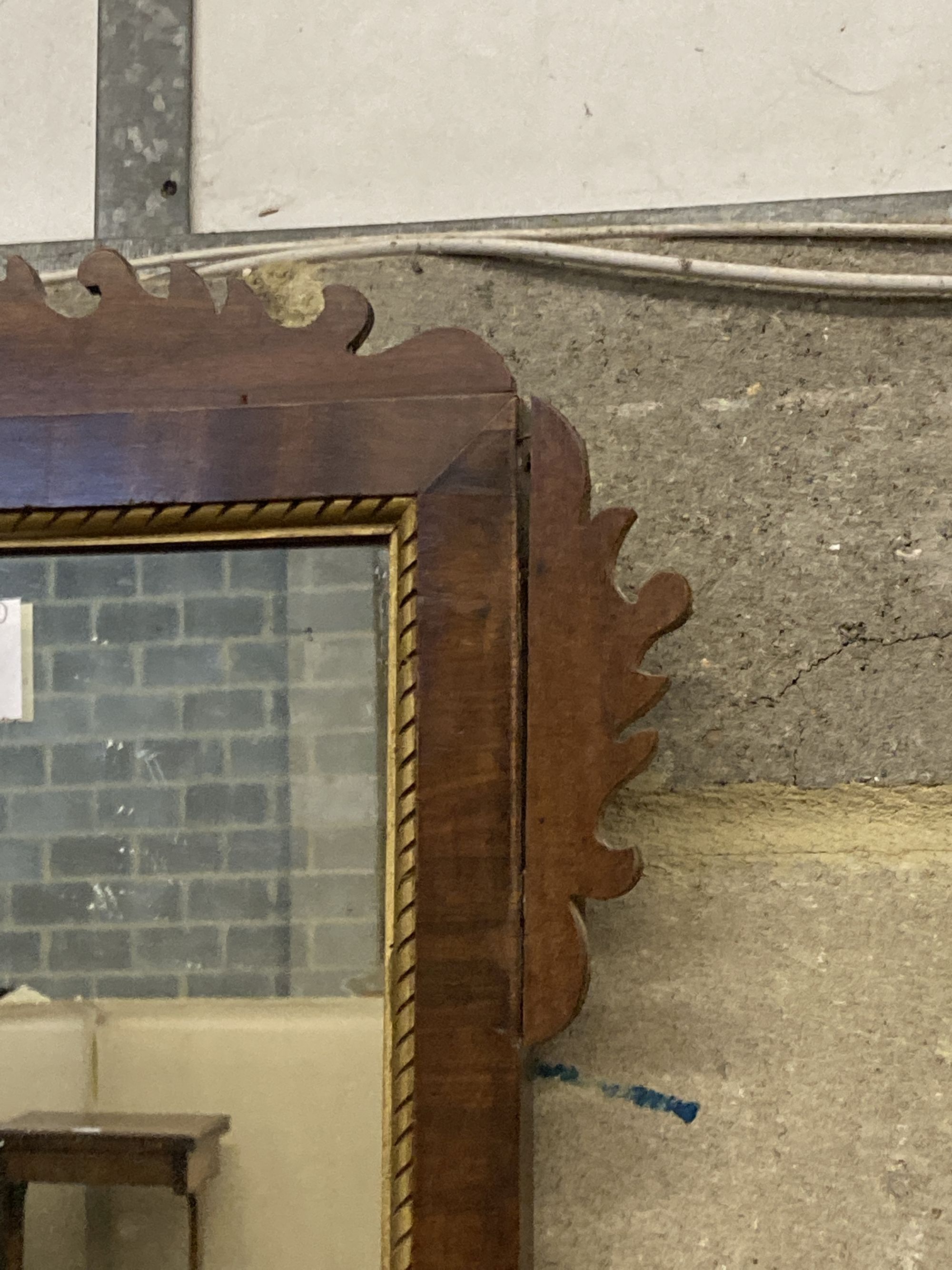 A George III style mahogany fret cut wall mirror, width 42cm, height 80cm